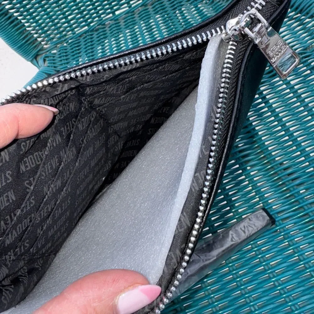 Steve Madden Black Round Logo Zip Clutch